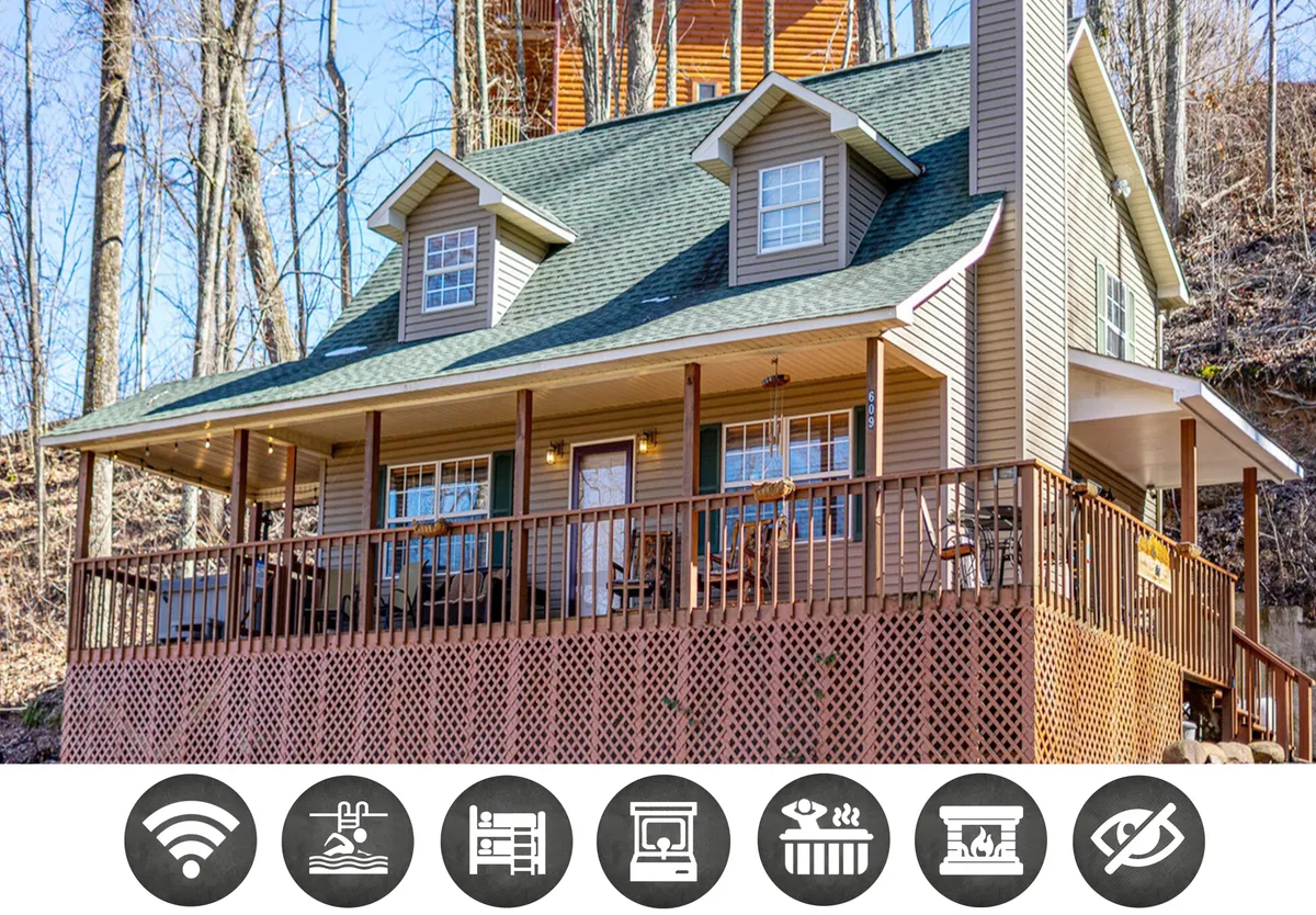 The image showcases the charming exterior of a single-family chalet surrounded by lush trees, featuring a spacious wooden deck and inviting front porch—ideal for relaxation and gatherings. The architecture highlights a classic mountain retreat style, with ample outdoor space perfect for enjoying sunsets and nature.
